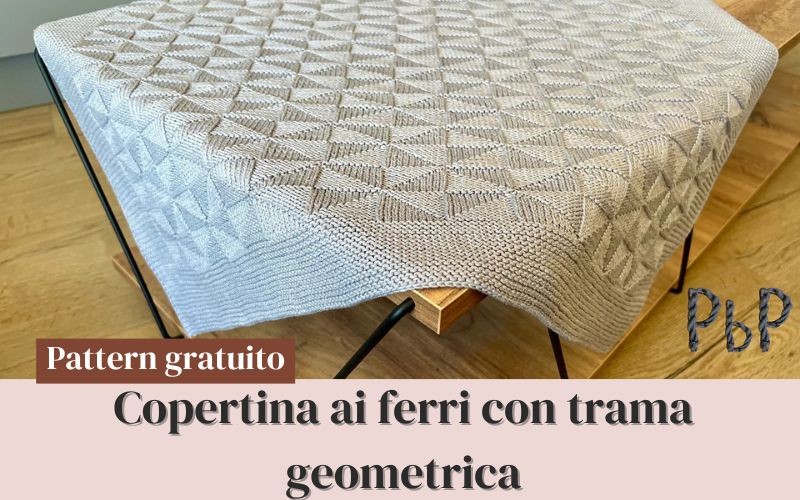 Copertina neonato ai ferri: modello geometrico